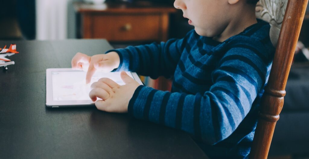 Child using a reading app to learn to read