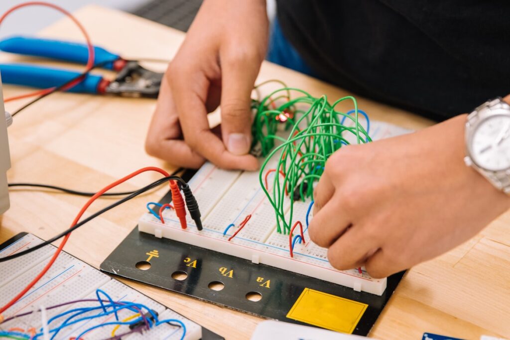 Kids building a computer using a circuit board kit