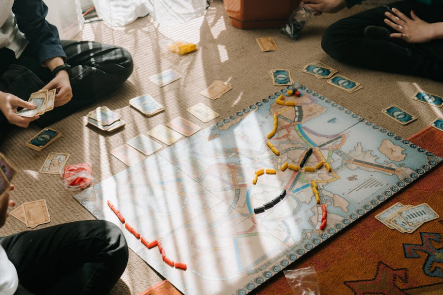 picture of family playing board game together